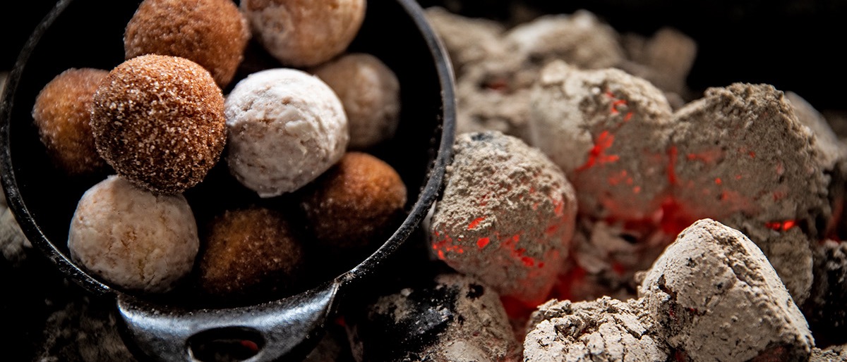 Omni Season of Smoke — smoked doughnut holes served over glowing coals